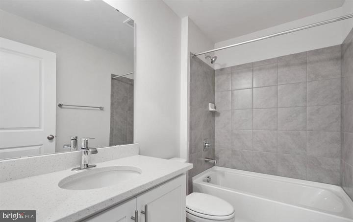 8710 Cherrybark Road Clinton, MD 20735 - Photo 15 of 19 a bathroom with a sink toilet and shower