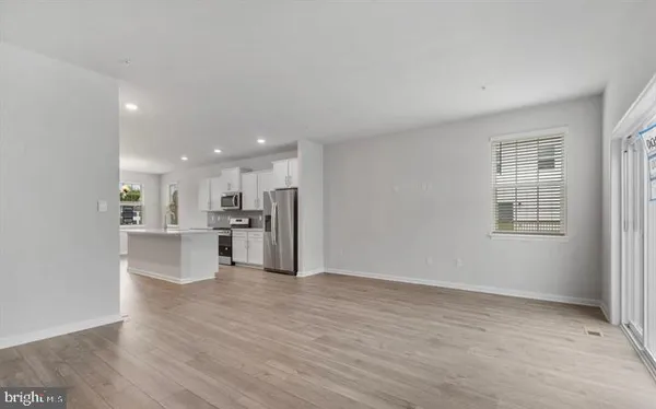 a view of kitchen with wooden floor