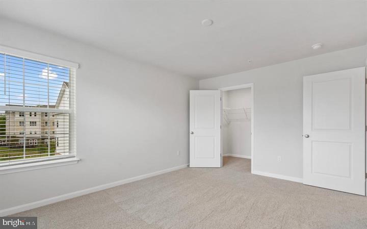 8710 Cherrybark Road Clinton, MD 20735 - Photo 9 of 19 a view of an empty room with a window
