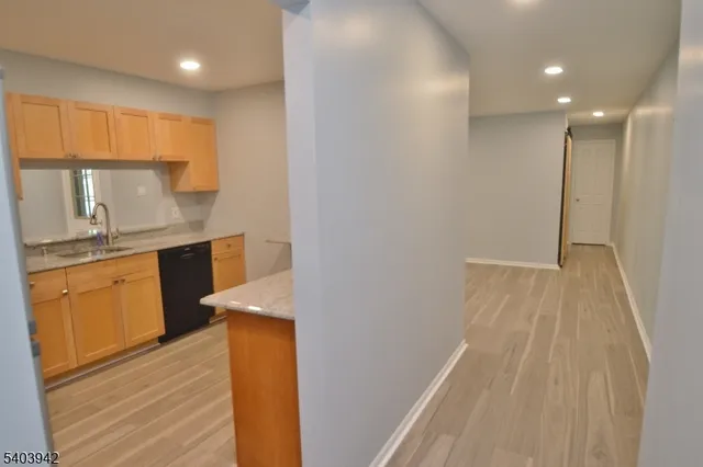 a bathroom with a sink a mirror and a shower