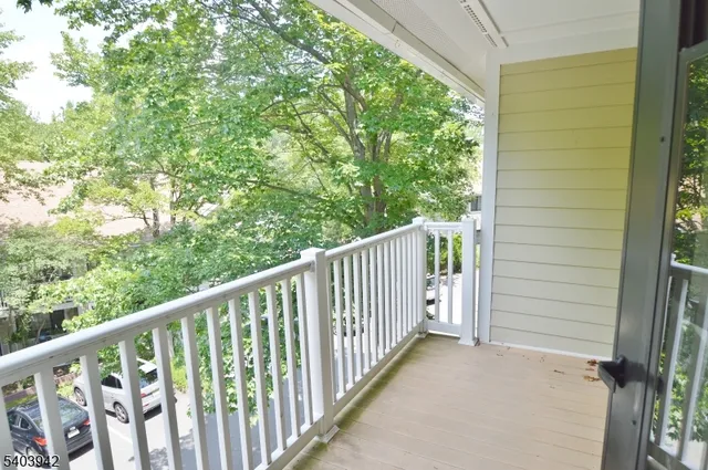 a view of a balcony with window