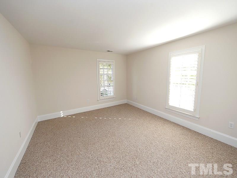 2301 Elmsford Way Raleigh, NC 27608 - Photo 22 of 25 an empty room with a window