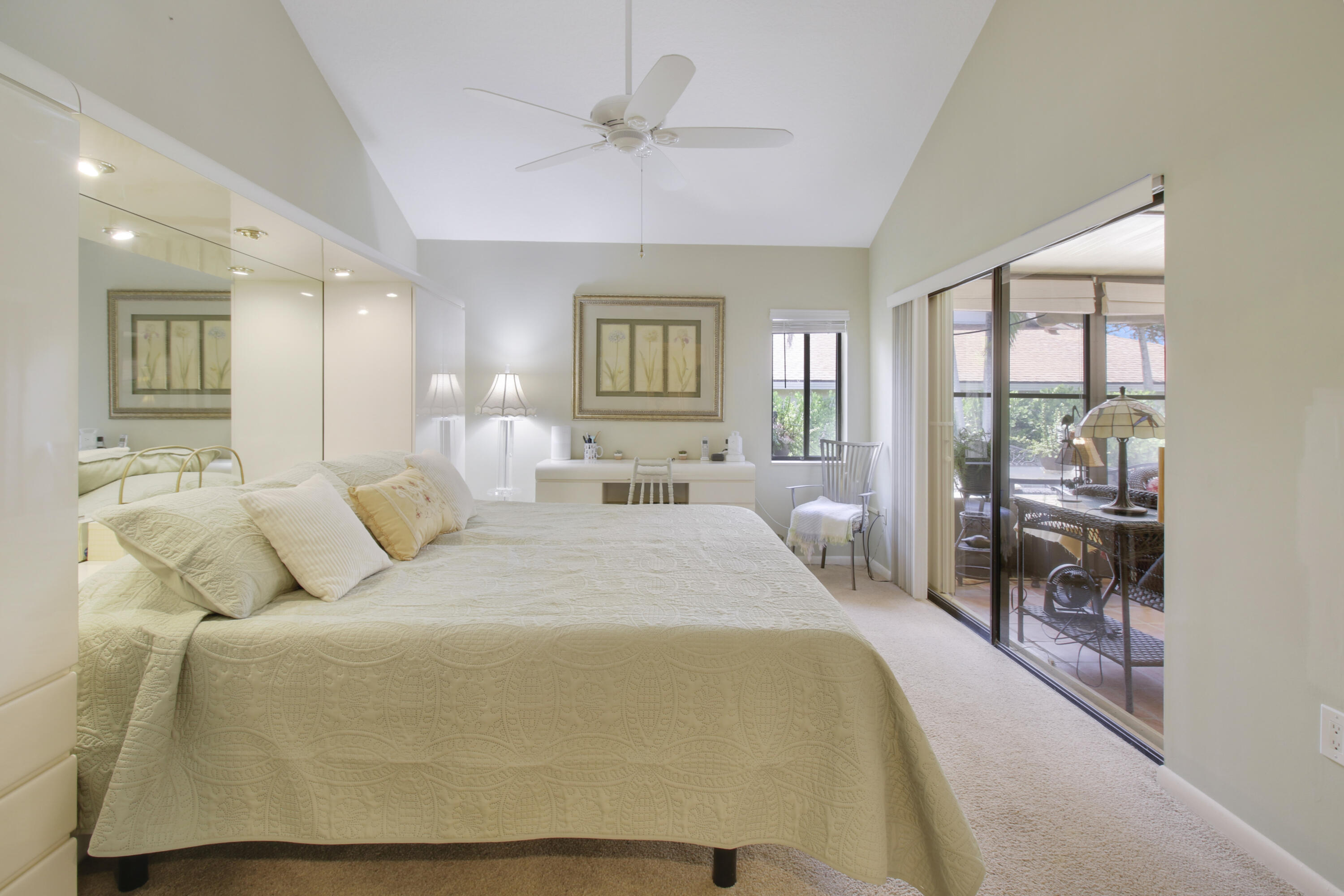 104 Harbourside Circle Jupiter, FL 33477 - Photo 20 of 41 a bed room with a bed and a chair