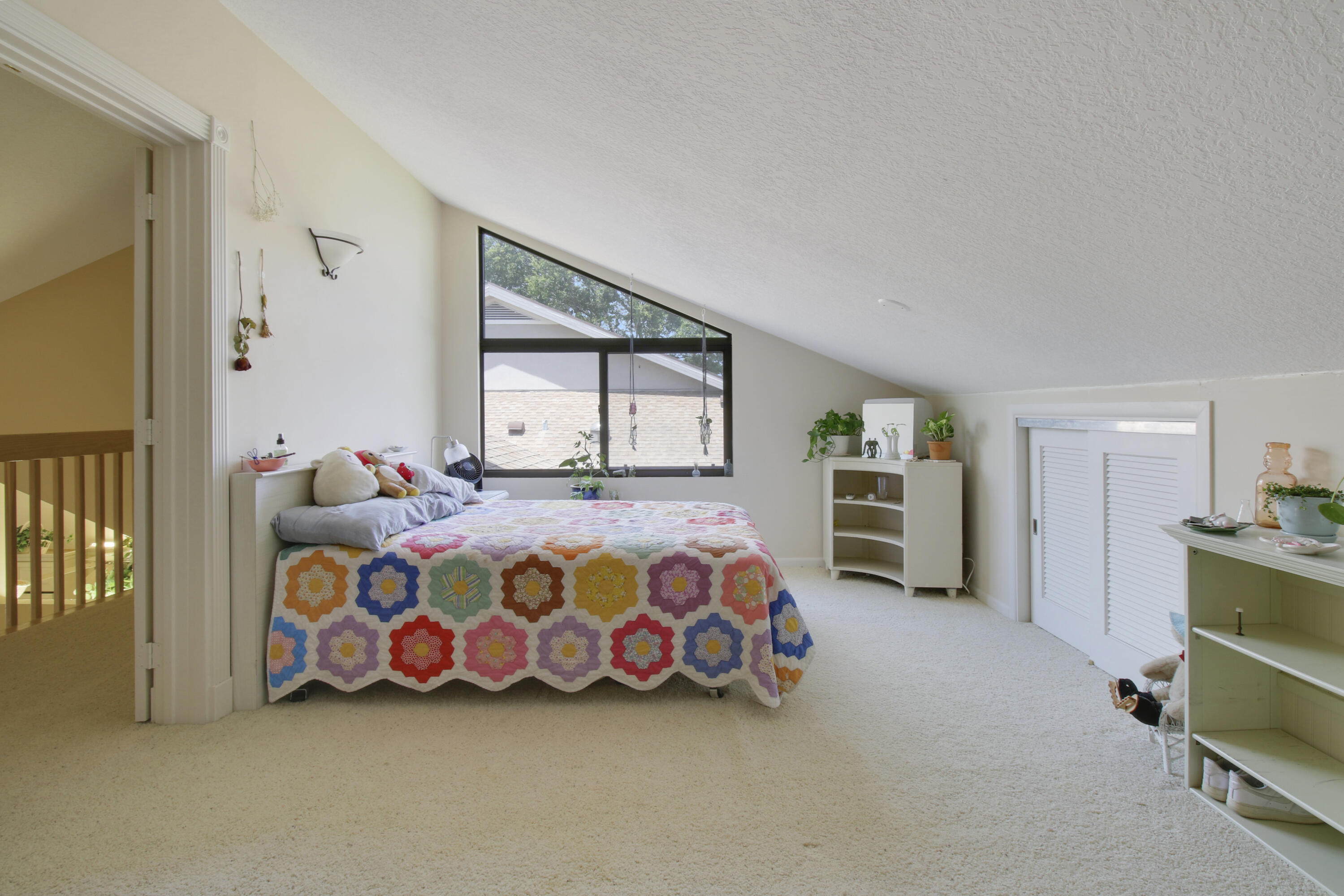 104 Harbourside Circle Jupiter, FL 33477 - Photo 29 of 41 a bedroom with a bed and a large window