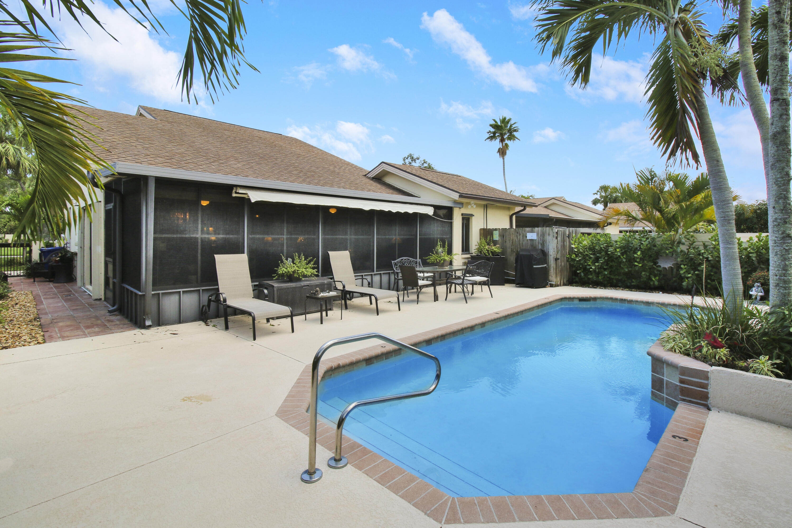 104 Harbourside Circle Jupiter, FL 33477 - Photo 34 of 41 a view of a patio with swimming pool table and chairs