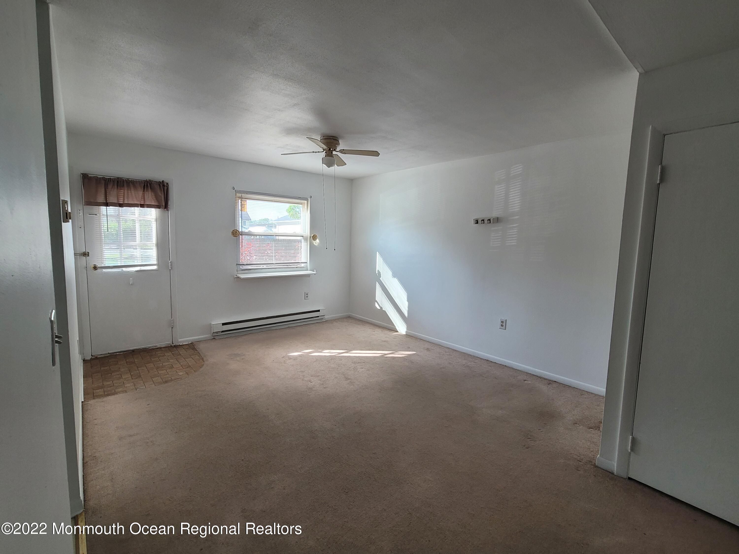 a view of empty room with windows