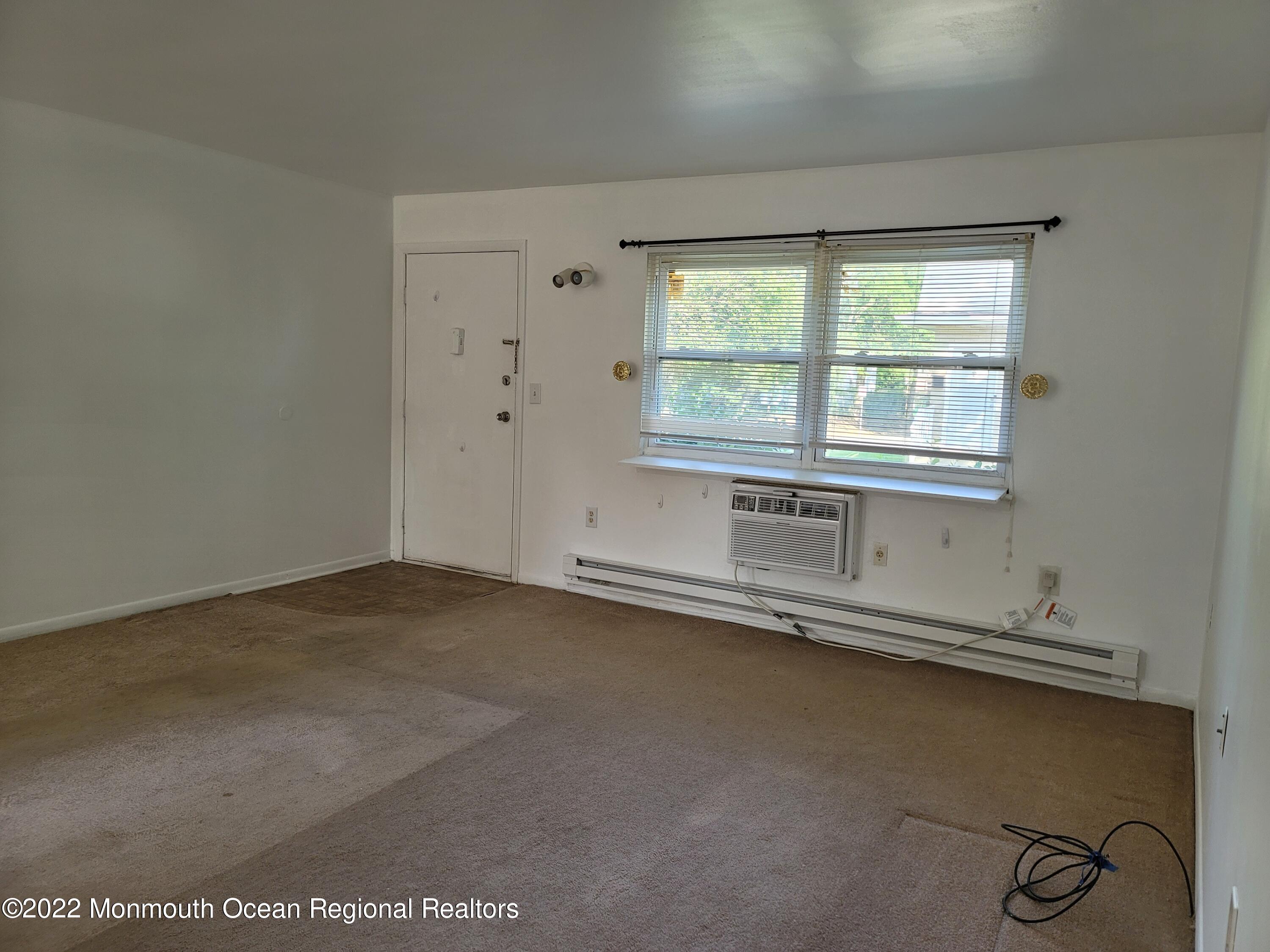 55 White Street, Unit C Eatontown, NJ 07724 - Photo 12 of 21 an empty room with a window