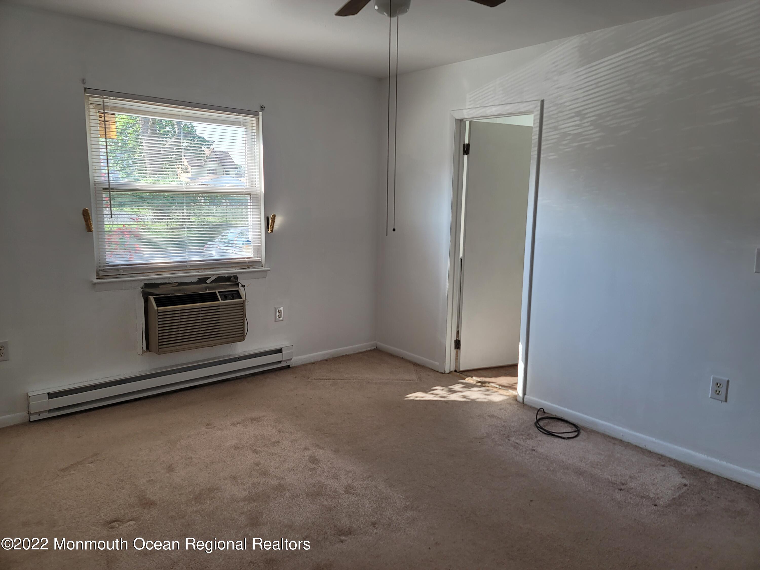 55 White Street, Unit C Eatontown, NJ 07724 - Photo 13 of 21 a view of an empty room with a window