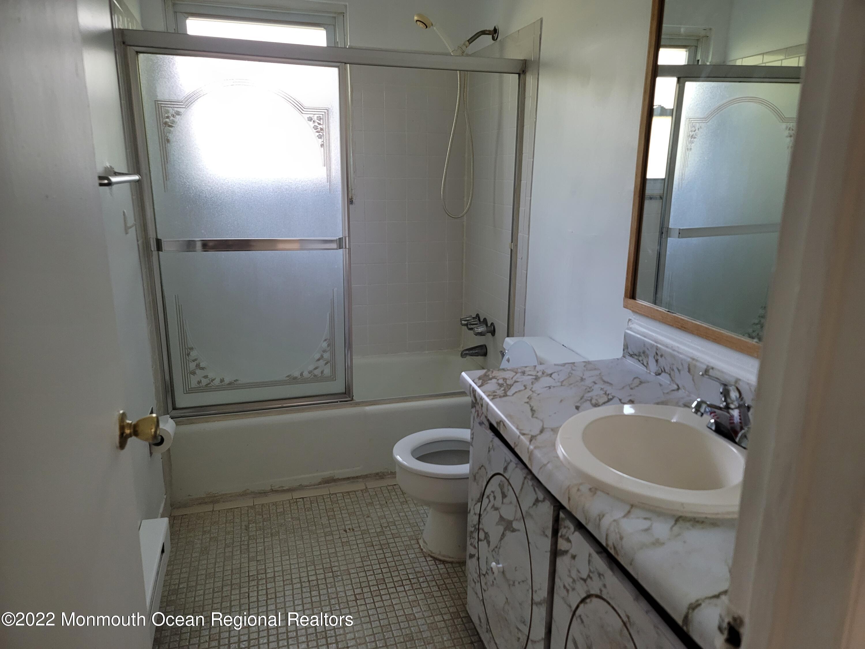 55 White Street, Unit C Eatontown, NJ 07724 - Photo 15 of 21 a bathroom with a sink toilet and shower