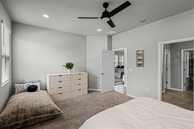 a bedroom with a bed and a dresser