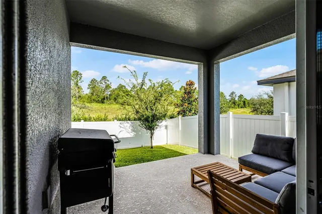 a room with furniture and a large window