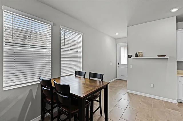 a view of a dining room with furniture and window