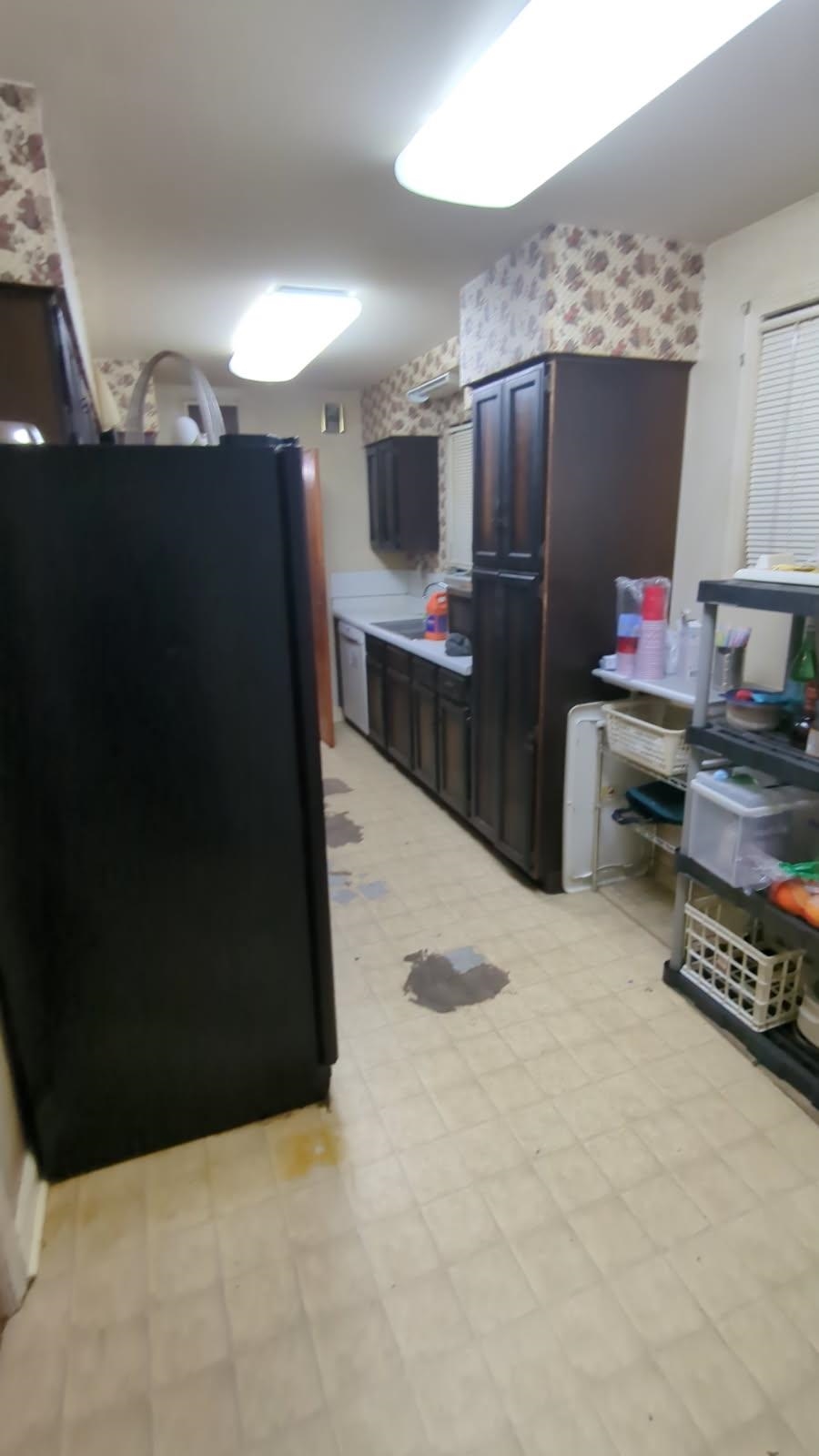 1026 Wingfield Road Memphis, TN 38122 - Photo 10 of 19 Kitchen with freestanding refrigerator, light floors, and light countertops