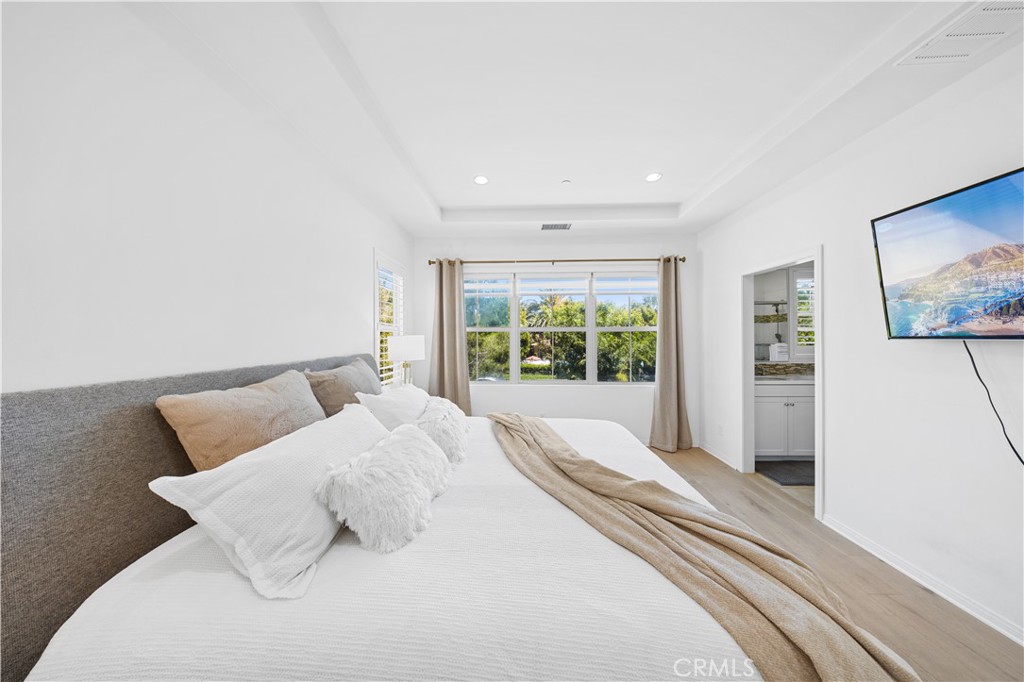 55 Rembrandt Irvine, CA 92620 - Photo 16 of 29 a bedroom with a bed and a large window