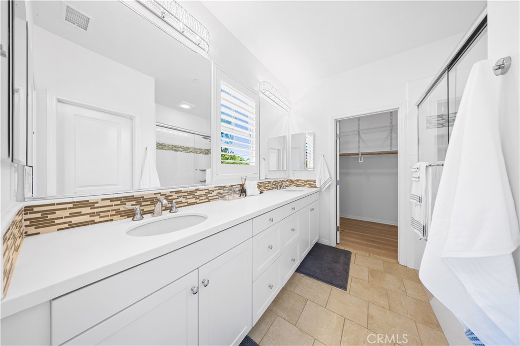 55 Rembrandt Irvine, CA 92620 - Photo 17 of 29 a spacious bathroom with a sink and a mirror