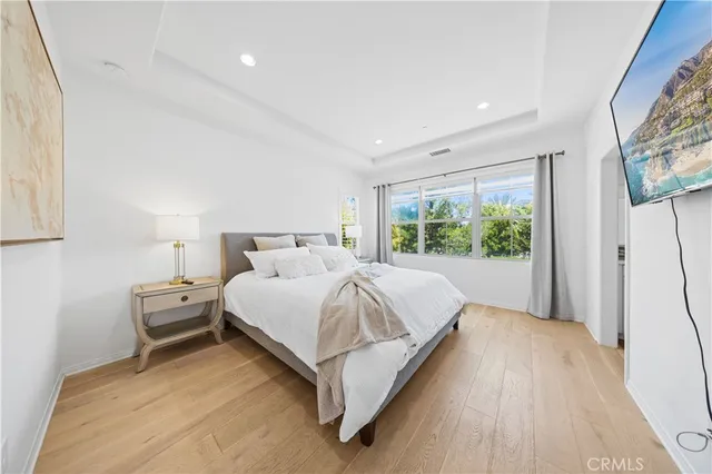 a bathroom with a double vanity sink toilet and a mirror