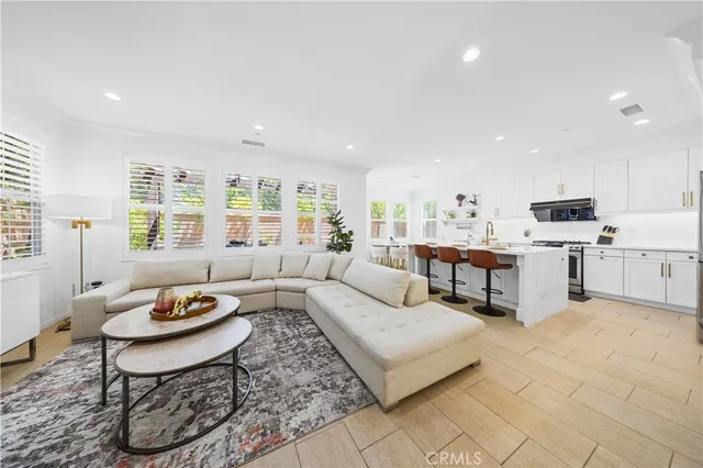 a living room with fireplace furniture and a table