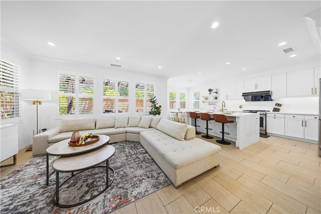 55 Rembrandt Irvine, CA 92620 - Photo 5 of 29 a living room with fireplace furniture and a table