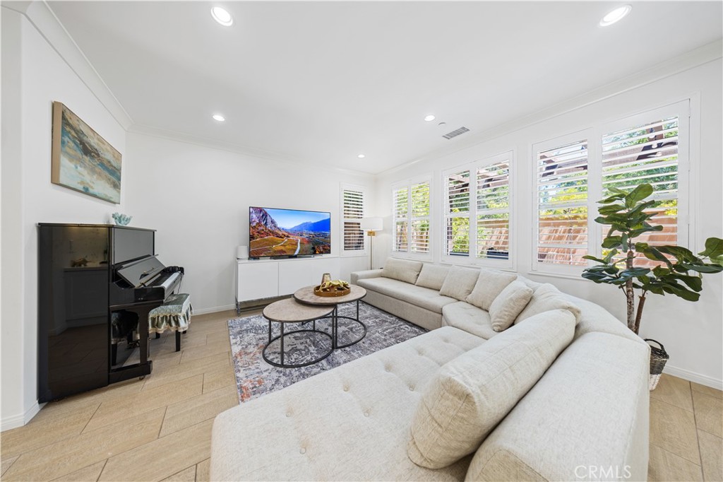 55 Rembrandt Irvine, CA 92620 - Photo 6 of 29 a living room with furniture and a large window