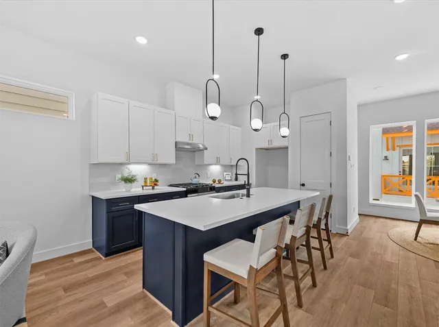 a kitchen with a table and chairs in it