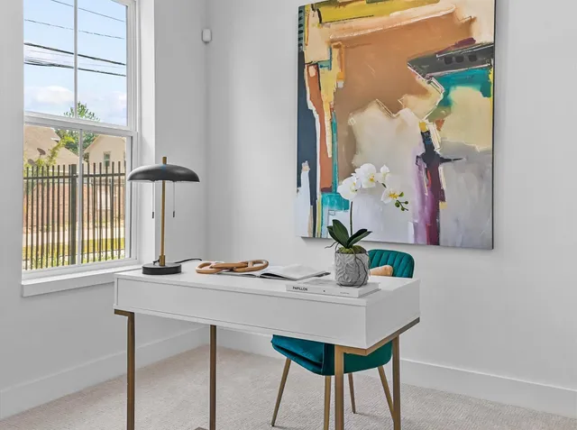 a dining room with table and chairs