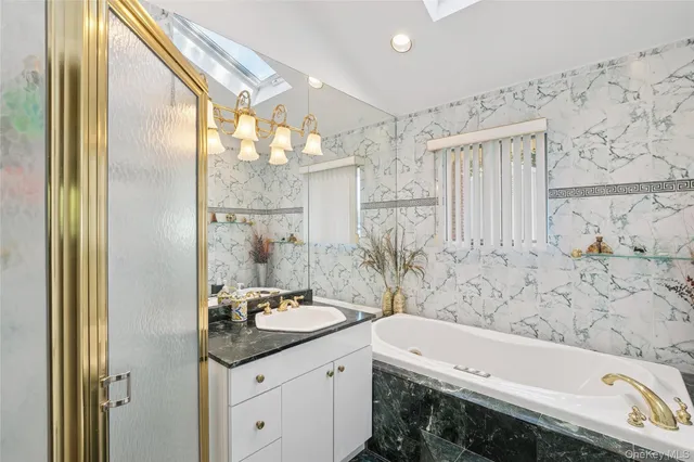 a bathroom with a bathtub and a sink