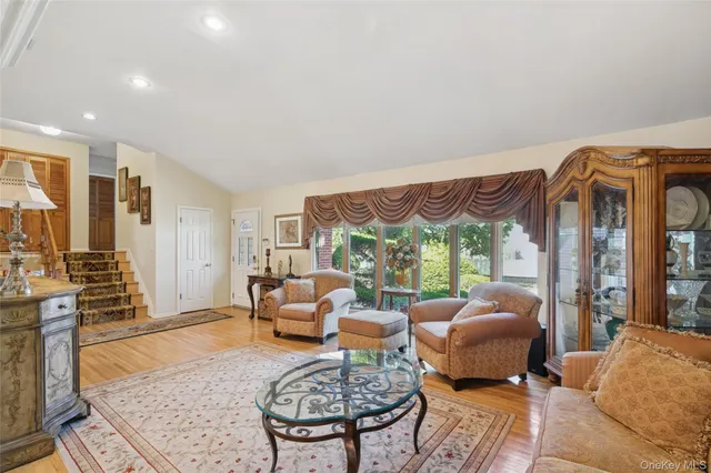 a living room with furniture fireplace and a table