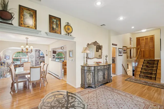 a living room with stainless steel appliances kitchen island granite countertop furniture and a kitchen view