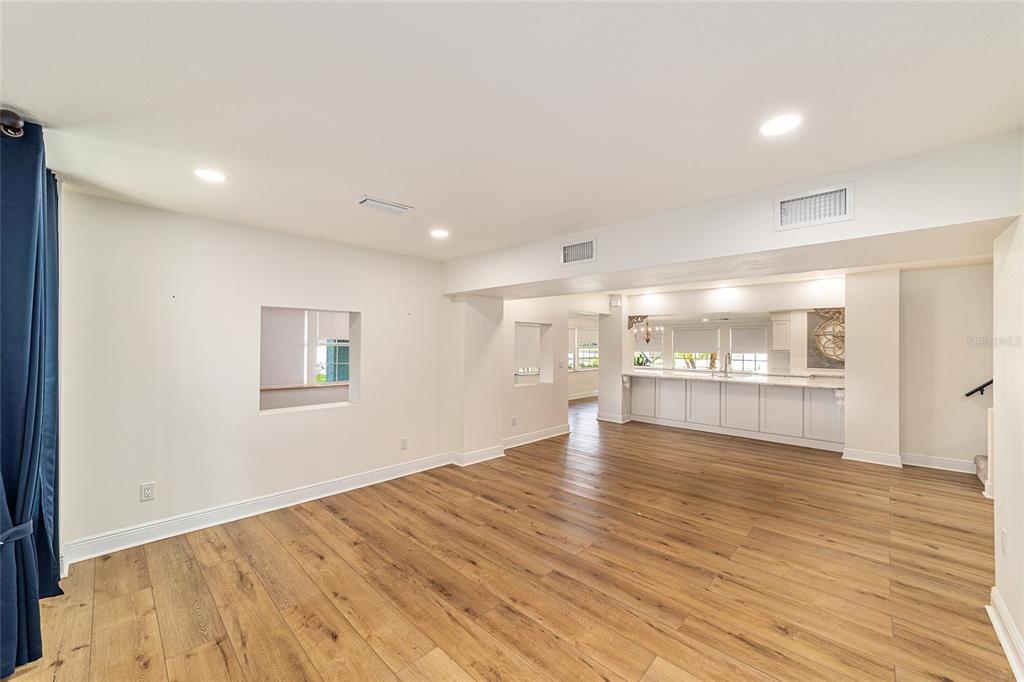 10399 Northeast 218th Lane Road Fort McCoy, FL 32134 - Photo 30 of 68 a view of empty room with wooden floor