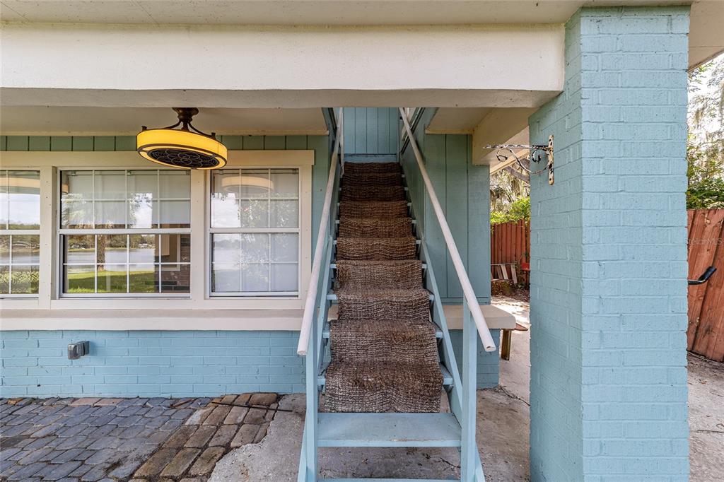 10399 Northeast 218th Lane Road Fort McCoy, FL 32134 - Photo 35 of 68 a front view of a house with entryway