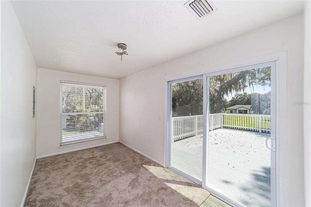 10399 Northeast 218th Lane Road Fort McCoy, FL 32134 - Photo 48 of 68 a view of an empty room and window