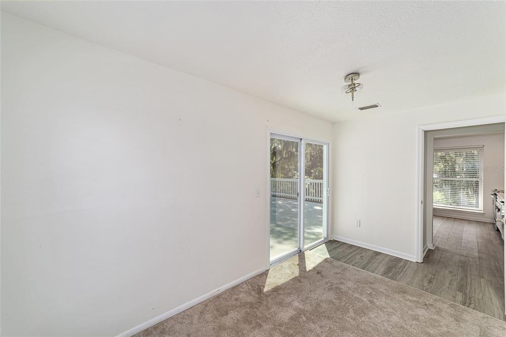 10399 Northeast 218th Lane Road Fort McCoy, FL 32134 - Photo 49 of 68 an empty room with windows