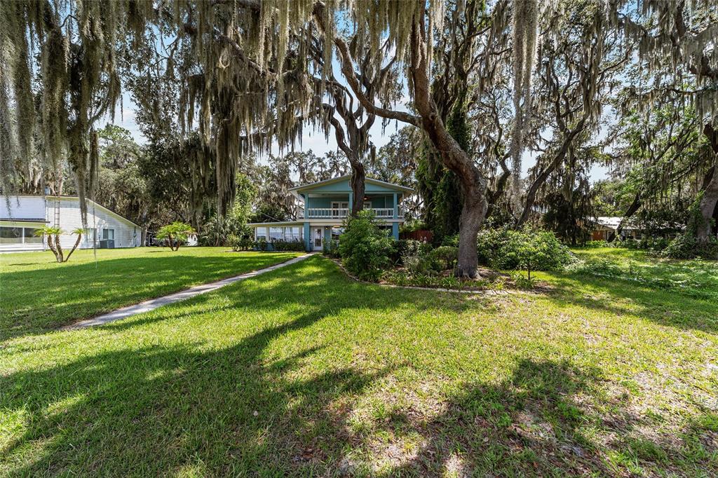 10399 Northeast 218th Lane Road Fort McCoy, FL 32134 - Photo 65 of 68 a view of a park with large trees