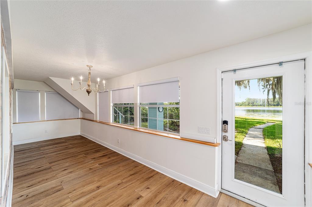 10399 Northeast 218th Lane Road Fort McCoy, FL 32134 - Photo 10 of 68 a view of empty room with wooden floor and fan