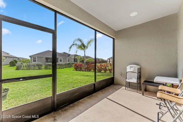 a view of a room with a large window