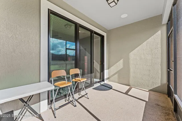 a living room with a table and chairs