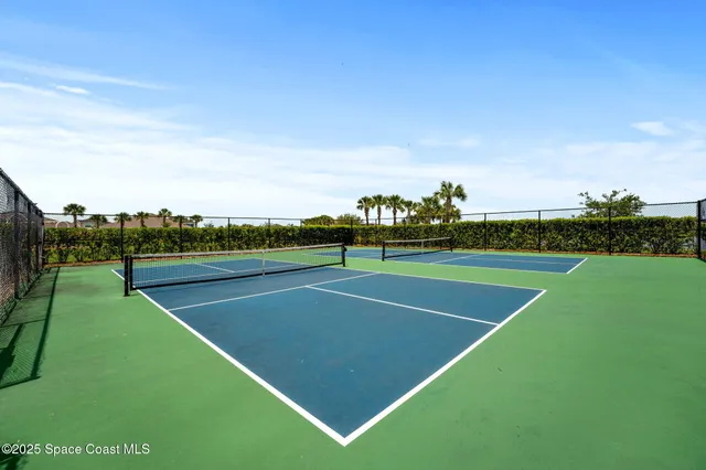 a view of an outdoor space and tennis court