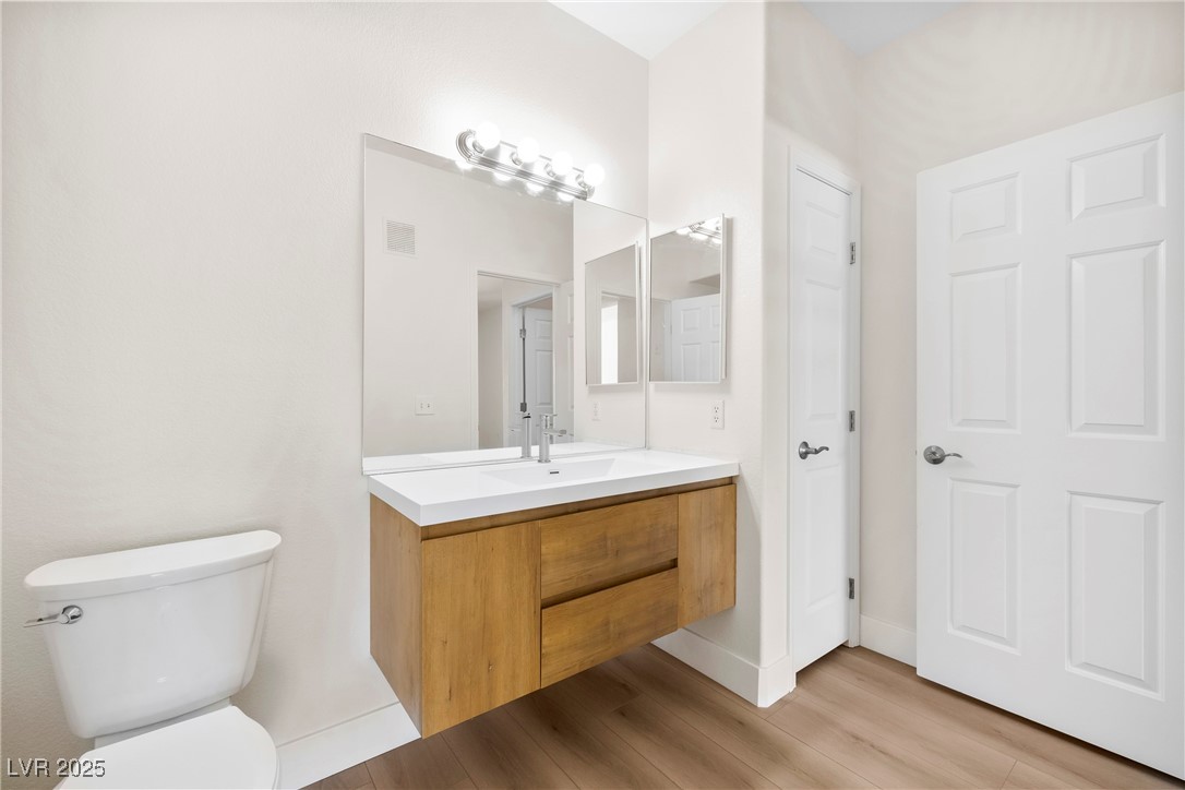 7139 South Durango Drive, Unit 203 Las Vegas, NV 89113 - Photo 19 of 25 Bathroom with vanity and brand new toilet