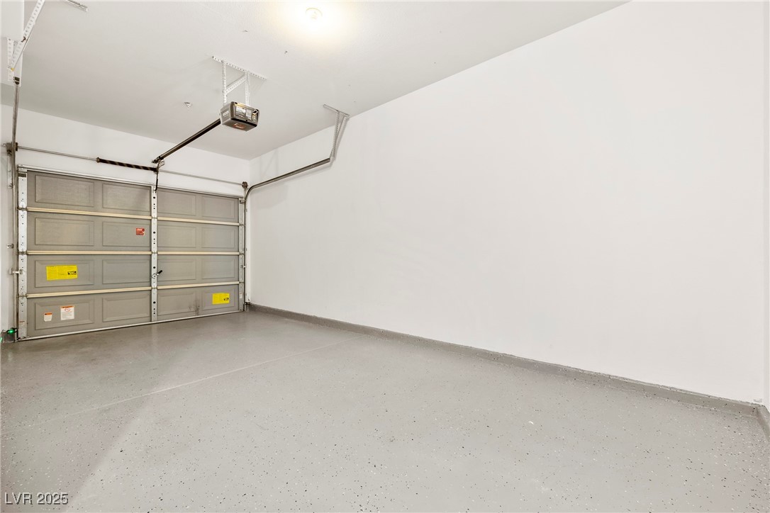7139 South Durango Drive, Unit 203 Las Vegas, NV 89113 - Photo 22 of 25 Attatched Garage with upgraded floor