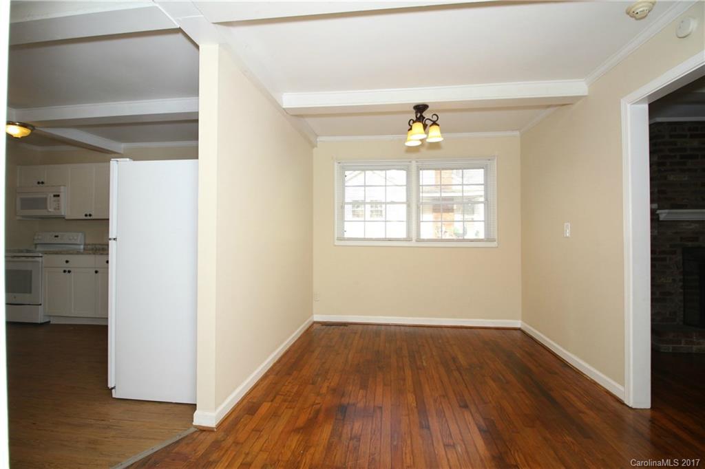 1104 Brantley Road Kannapolis, NC 28083 - Photo 6 of 14 a view of empty room with wooden floor and fan