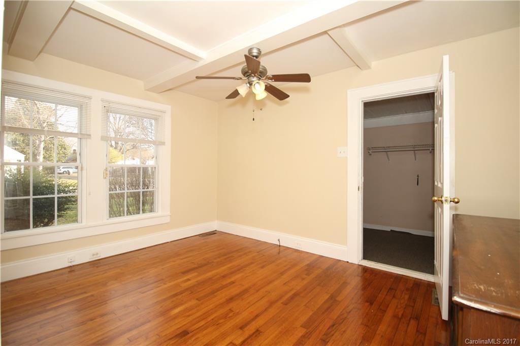 1104 Brantley Road Kannapolis, NC 28083 - Photo 9 of 14 an empty room with wooden floor fan and windows