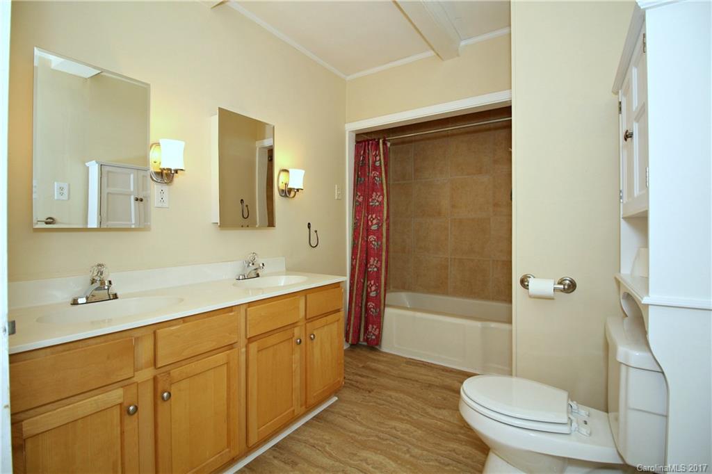 1104 Brantley Road Kannapolis, NC 28083 - Photo 10 of 14 a bathroom with a sink a toilet and shower