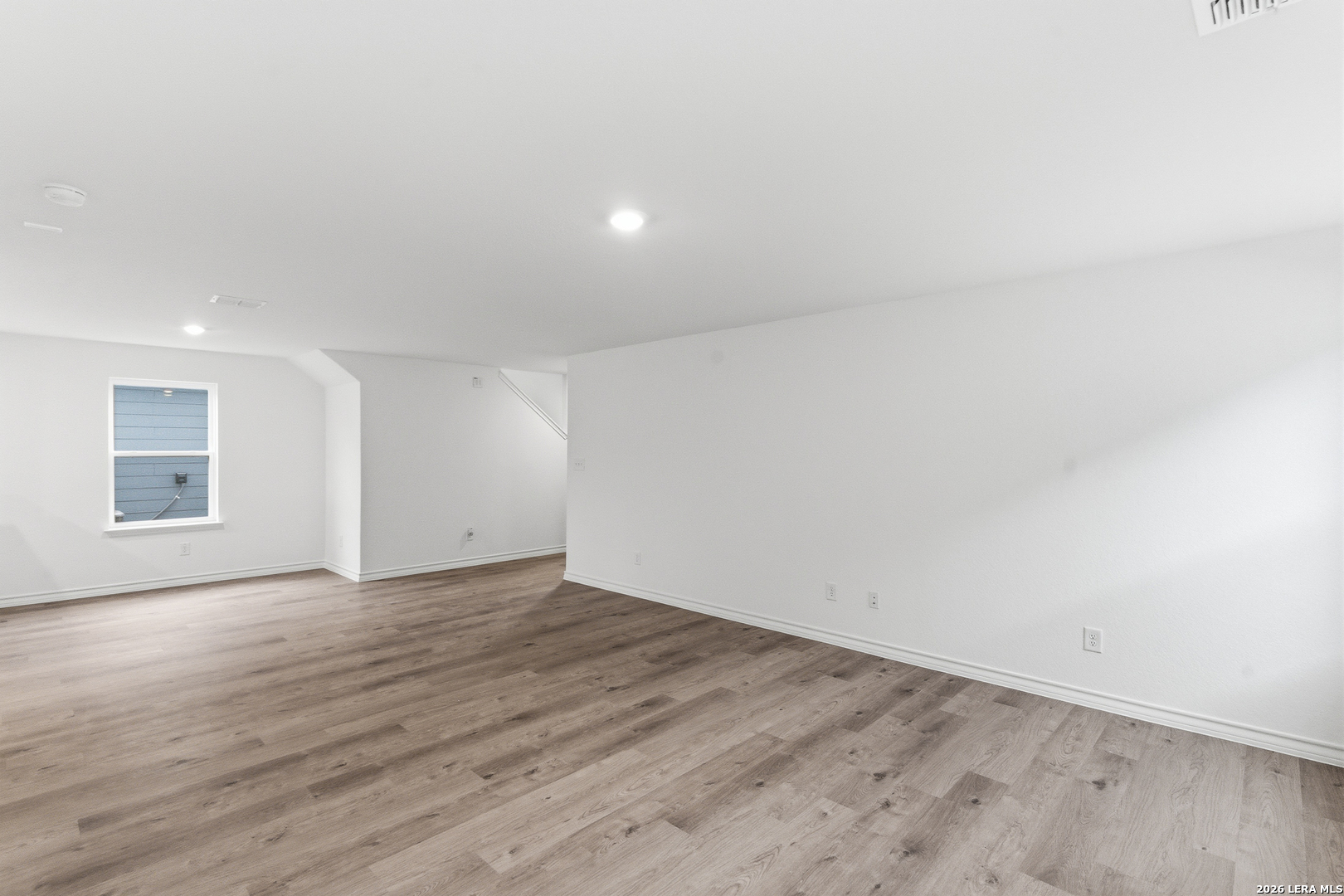 4057 Bermuda Lane Seguin, TX 78155 - Photo 28 of 30 an empty room with wooden floor and windows