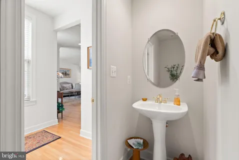a bathroom with a sink toilet and vanity