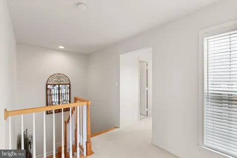 a bedroom with a bed and chair