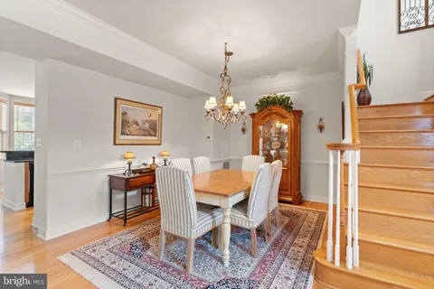 a living room with furniture a fireplace and a large window
