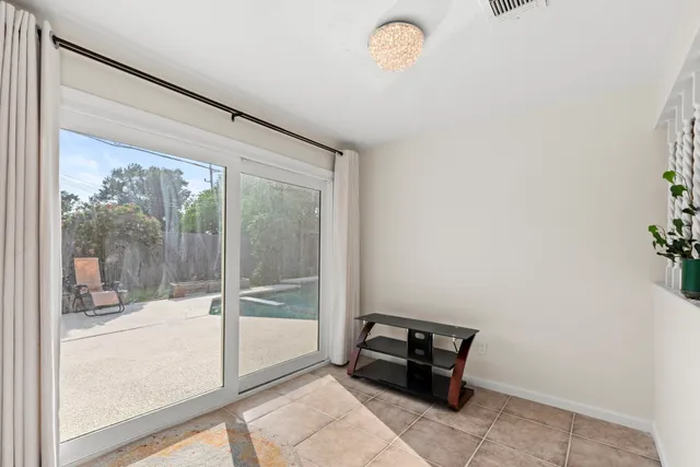 a room with sliding glass door and glass door