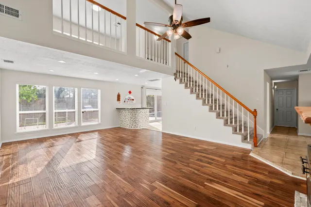 a view of an entryway with wooden floor