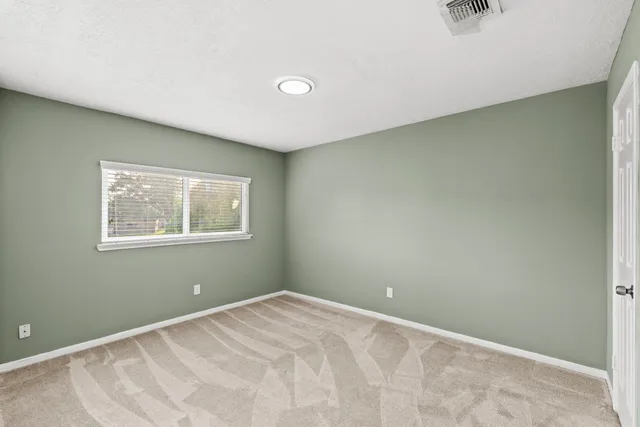 a view of a room with a window