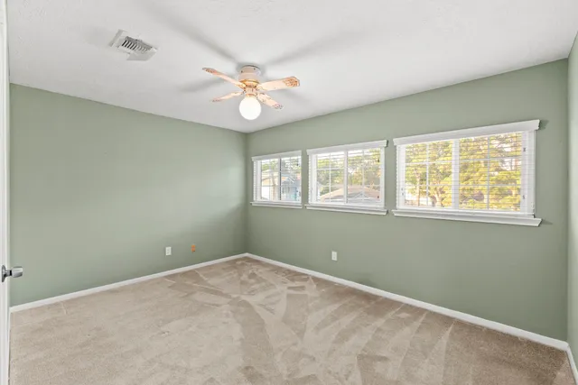 a view of empty room with windows